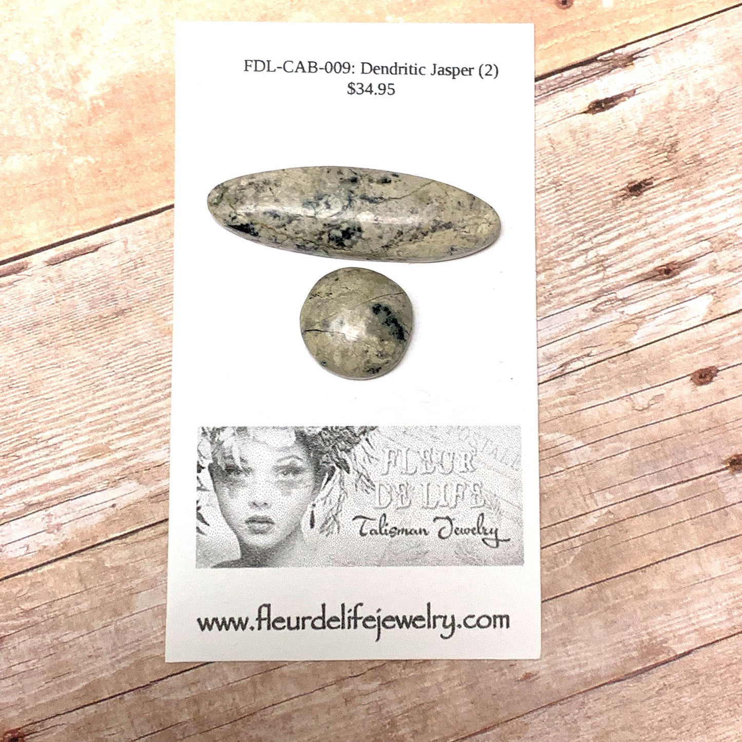 DENDRITIC JASPER CABOCHON SET. SAND. BLACK. 40MM X 12MM OVAL 16MM ROUND.