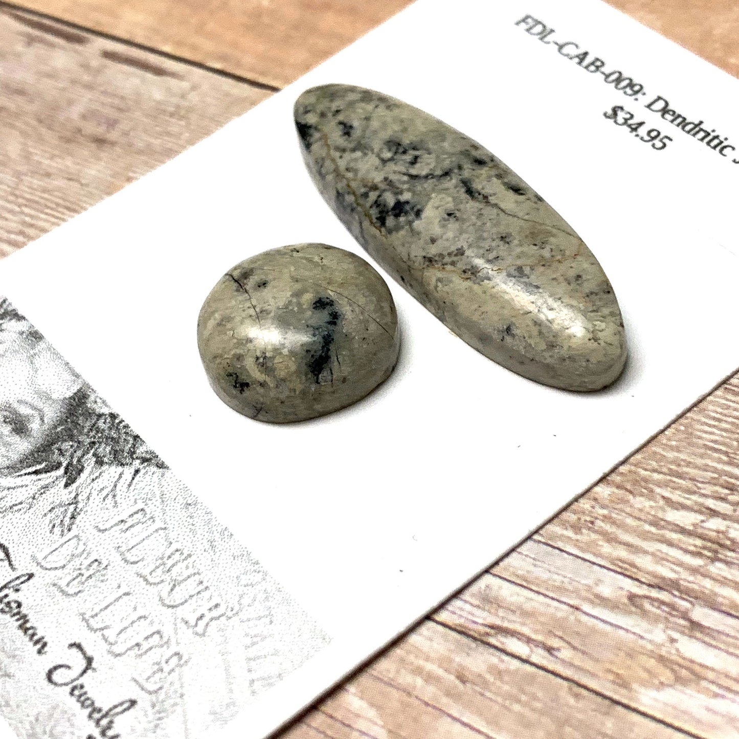 DENDRITIC JASPER CABOCHON SET. SAND. BLACK. 40MM X 12MM OVAL 16MM ROUND.